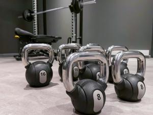 a row of dumbbells in a gym at ibis Styles Berlin Treptow in Berlin