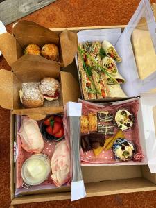 a box filled with different types of food at Garden Flat- Private Luxury in Ashkirk +16 photos