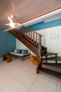 a living room with a staircase and a bench at Hotel do Pescador in Morro de São Paulo
