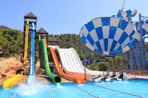 a water park with a water slide and a roller coaster at El Rincón Playero de María II TOTALMENTE REFORMADO ABRIL 2022 in Benidorm