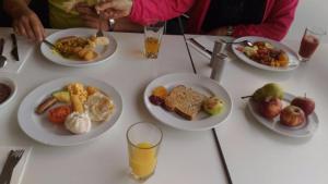 a white table with plates of food on it at Oceans 11 in Gold Coast