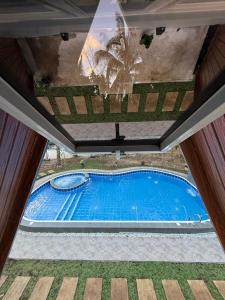 an overhead view of a swimming pool in a house at The Siblings Farm House in Liliw +7 photos