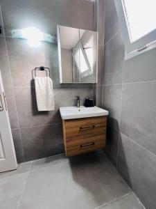 a bathroom with a sink and a mirror at Villa Lapethos in Kyrenia