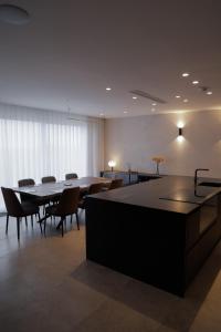a conference room with a table and chairs in it at Sunset Edge Villa - 77 Retreats in Għajn Tuffieħa +63 photos