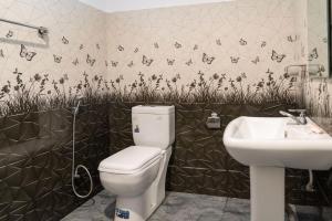 a bathroom with a toilet and a sink at Lake Edge Resort in Hambantota +50 photos