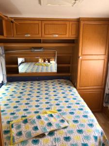 a bed in the back of a van at Caravane revisité in Pleslin-Trigavou