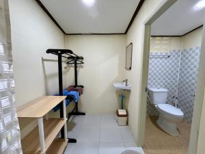 a bathroom with a toilet and a sink at บ้านสวนบรรจงอักษร Bansuan Banjong Akkson in Rayong +29 photos