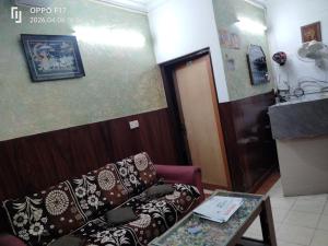 a living room with a couch and a table at Hotel Diamond palace 45C in Chandīgarh