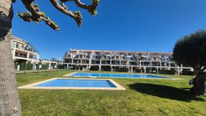 a resort with a large building in the background at Panoràmic Vinaros in Sant Jordi