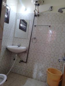 a bathroom with a shower and a sink and a toilet at Hotel Diamond palace 45C in Chandīgarh