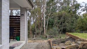a side view of a house with a porch at The Piddington Top in Mount Victoria
