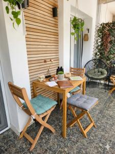 a patio with a table and two chairs at Dimi Guest House in Perea