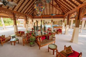 an outdoor patio with chairs and tables and a ceiling at Ayada Maldives - Complimentary domestic transfer for 2 Adults for stays of 7 nights or more, valid for stay dates from May through the end of September 2026 in Vaadhoo +166 photos