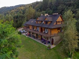 an aerial view of a house in the mountains at Barnilka House Klimkówka in Klimkówka