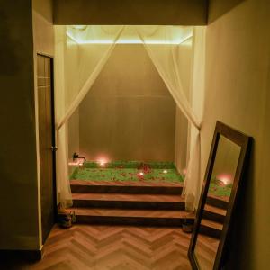 a stairway with a room with a window with lights at Aspen Riverside Resort in Rishīkesh