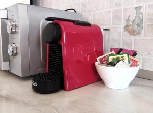 a red coffee maker sitting next to a mixer at Kuća za odmor Boris in Podstrana