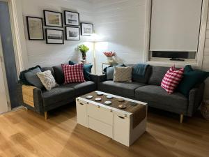 a living room with a couch and a table at The Guesthouse in Terang