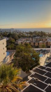 an aerial view of a parking lot and the ocean at Ocean View Ponderosa 601 Costa Adeje Playa de las Americas in Costa de Adeje