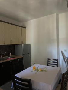 a small kitchen with a table and a refrigerator at Sior in Golem