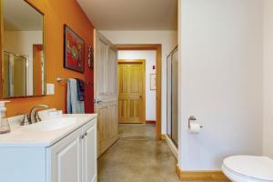 a bathroom with a sink and a toilet at Secluded 2 BR Cottage w/ Private W/D, WiFi & Patio in Franklin Road +17 photos