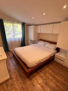 a bedroom with a large bed in a room at Sea View Penthouse in Durrës