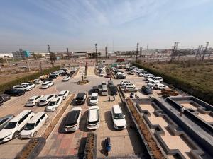 an aerial view of a parking lot with cars parked at Jawla Resort in Palwal