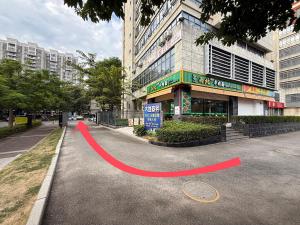 a red line on a street in front of a building at Four Seasons Clouds Xiamen North Railway Station Store in Xiamen