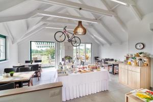 a bike hanging from the ceiling in a restaurant at Sonjas Auszeit in Rust