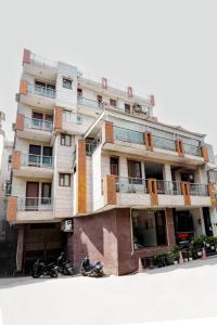 a building with motorcycles parked in front of it at Hotel AR Residency in New Delhi