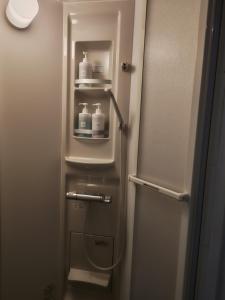 a refrigerator with bottles of milk inside of it at The hostel kobe in Kobe +50 photos