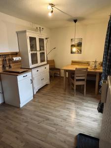 a kitchen and dining room with a table and a dining room at Fagererhof in Bad Reichenhall