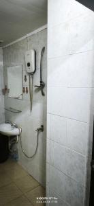 a bathroom with a shower and a sink at Redbull guest house in Pattaya +2 photos