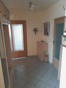 a room with a hallway with a door and a window at Appartment Annika in Hochheim