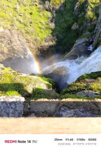 a rainbow in the middle of a river at La ERA in Aldeadávila de la Ribera