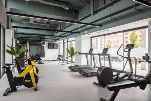 a gym with several treadmills and cardio machines at Amro Pamplona - Albergue Juvenil in Pamplona