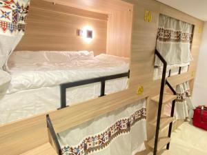 a couple of bunk beds in a room at 12H Hostel in Al-ʿUla