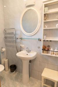 a bathroom with a sink and a mirror at AV villa in Nida +16 photos