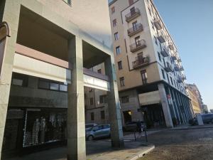 a building with a car parked in front of it at DeMarchi in Biella
