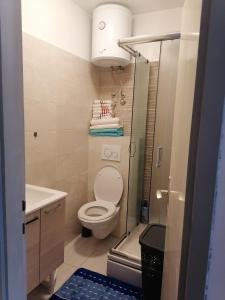 a small bathroom with a toilet and a sink at D & G in Split