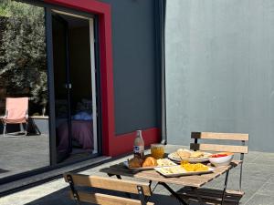 a table with a tray of food on it at Primeiro Quartel Apartments - 1 in Peso da Régua +21 photos