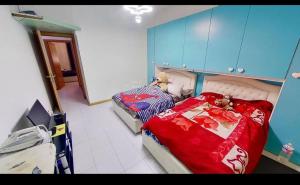 a small bedroom with a bed and a crib at private room in Seveso