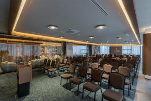 a conference room with a row of chairs at Central Hotel in Ferizaj