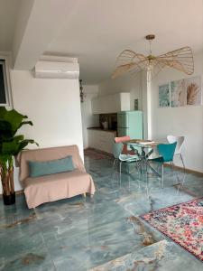 a living room with a couch and a table at Vista mare ! in Cervo