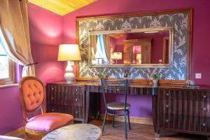 a room with a vanity with a mirror and chairs at Palomino Lodge - Still Rabbit - Hot Tub - Yorkshire in Selby
