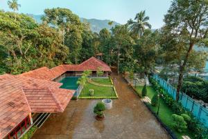 an aerial view of a house with a garden at Vynza Resort Vythiri in Vythiri