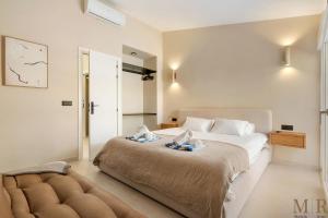 a bedroom with a bed with two pillows on it at Casa Eva Ref #97 in Estepona +17 photos