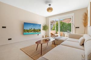 a living room with a couch and a table at Casa Eva Ref #97 in Estepona