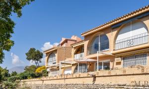 a building with balconies on top of a wall at Casa Eva Ref #97 in Estepona