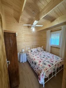 a bedroom with a bed and a wooden ceiling at El Palmito Rural Home in Jerez de la Frontera +5 photos