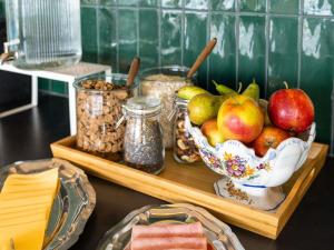 a table with a bowl of fruit and other foods at greet Brussels Airport Zaventem in Zaventem